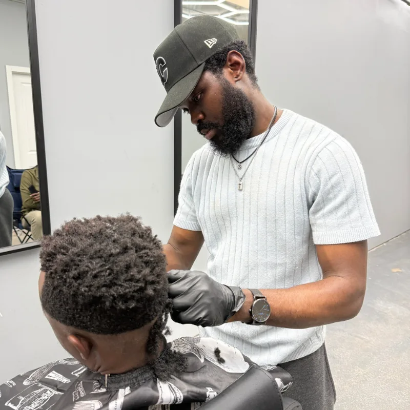 Expert hair styling in progress at DR COIFFURE Winnipeg